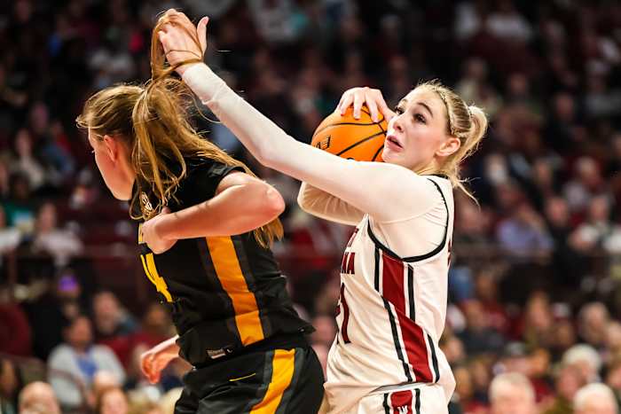 Chloe Kitts grabs a rebound over Missouri Tigers guard (8th Feb., 2024)